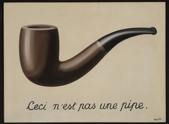 A pipe, with the caption 'This is not a pipe' in French.