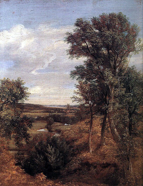 A landscape with several small houses in the distance.