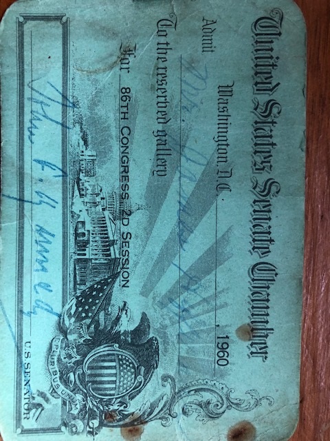 A blue pass to the US Sentate signed by John F. Kennedy.